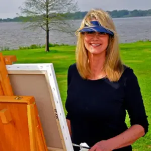 image of susan Temple Neumann standing if front of an easel