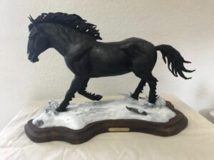 Bronze sculpture by Fred Boyer of a black stallion