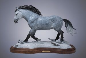 painted bronze sculpture of a grey dapple horse with black mane and tail