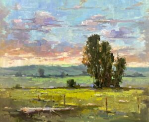 landscape painting by Michele Usibelli of a mountain valley view with a far mountain range, a colorful cloudy sky, and a tree