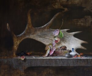 Still life painting by Jeff Legg of a Moose antler, with.a delicate tednril if leaves