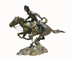 bronze sculpture by Scott Rogers of man running on a horse