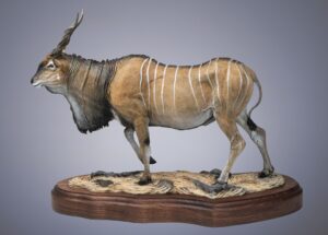 painted bronze sculpture by Fred Boyer of a beautiful antelope