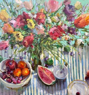 still life painting by Michele Usibelli of a table setting of a vase with colorful flowers, a bowl of fresh fruit and a tea cup and small plate