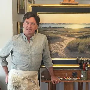 image of Mark Shasha standing in front of one of his paintings