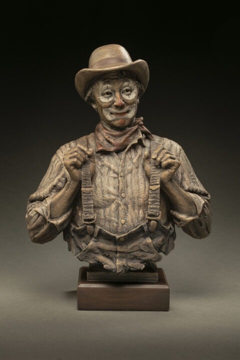 fron tof a bronze of a smiling rodeo clown