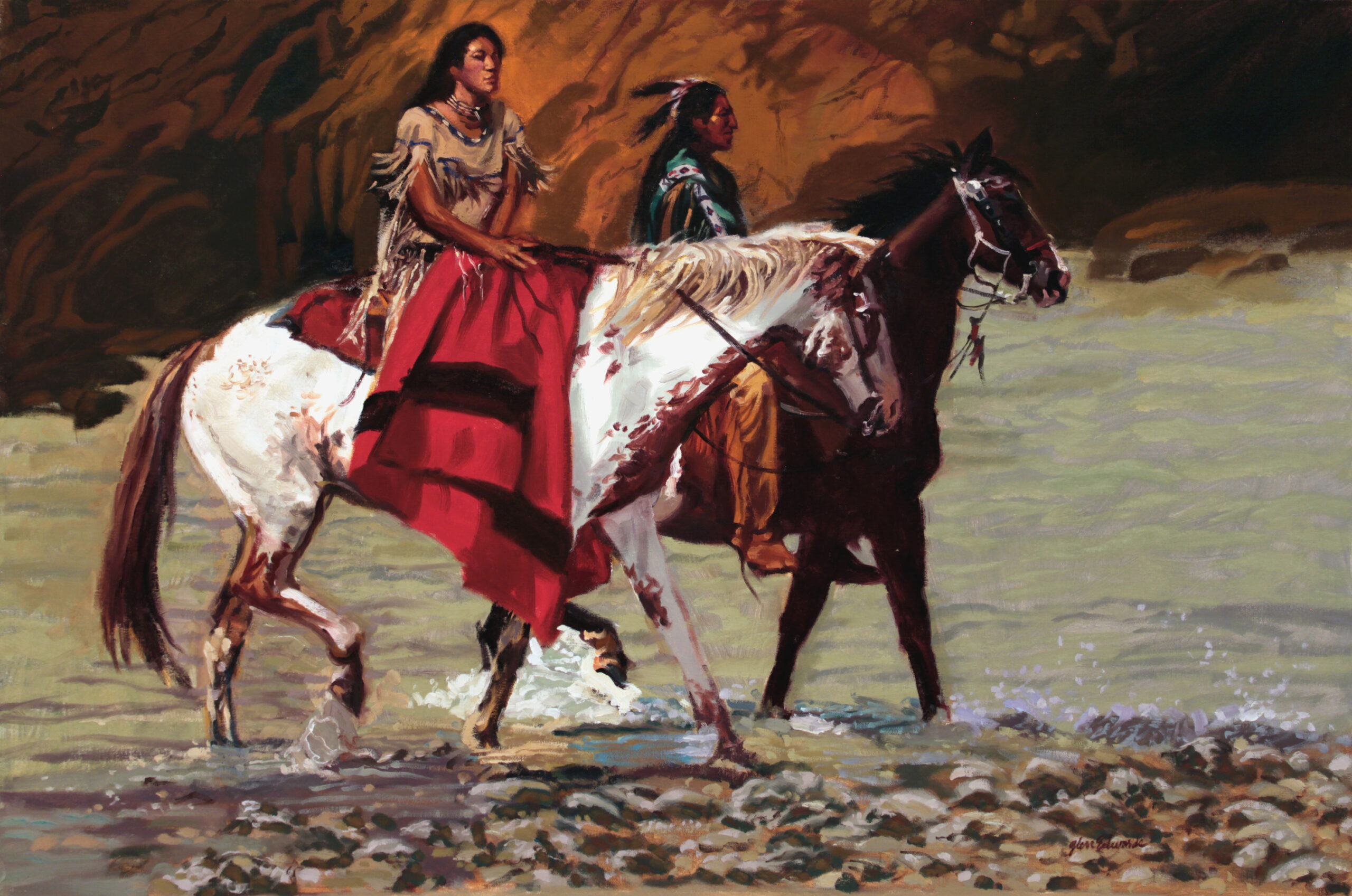 image of a male and a female native american. The female has a large blanket across her lap