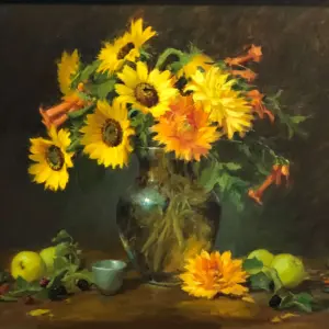 sunflowers woth greenery in a clear vase