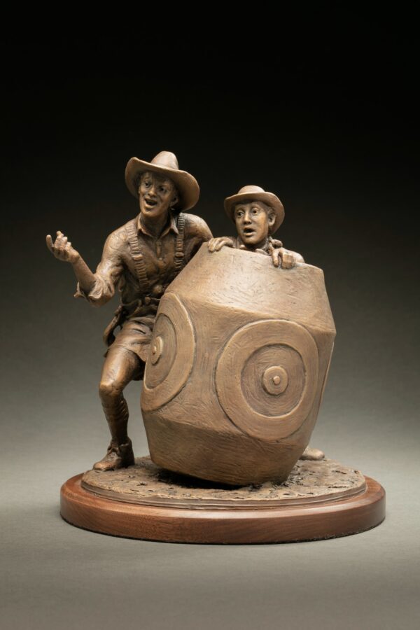 bronze of rodeo clowns taking shelter behind a barrel,