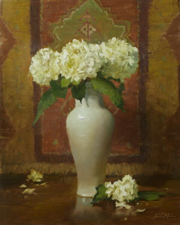 White hydreangea in a tall white vase