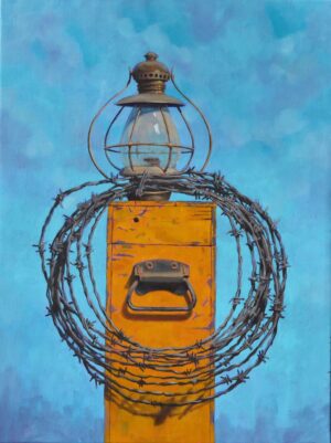 painting of a lantern and a coil of barbed-wire fence perced upon a wooden box with a metal handle on the side.