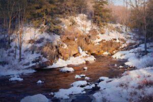 snow dappled creek with rocks