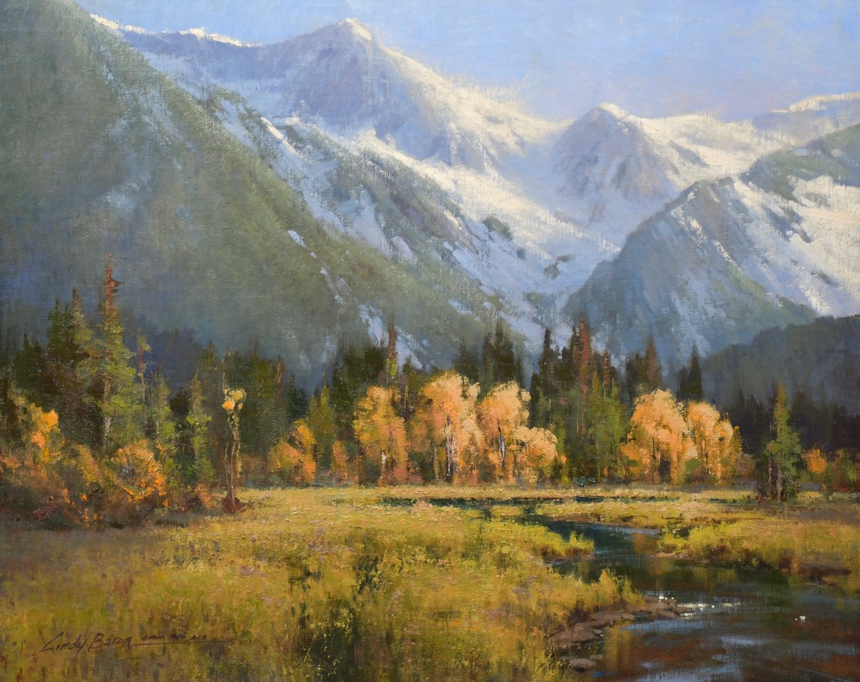 Painting by Cindy Baron of an autumnal scene showing trees with golden leaves in a vally, with snow covered mountains in the background