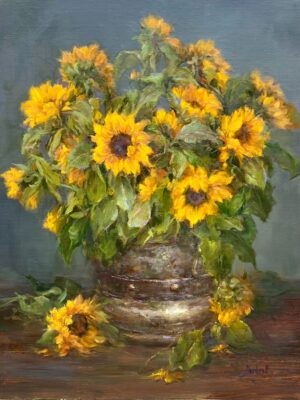 An impressionistic still life oil painting titled 'From Rome with love' by Stephanie Birdsall, featuring an abundant bouquet of vibrant yellow sunflowers with thick green leaves arranged in a rustic, metallic bucket with iron-style bands. Several fallen blooms and loose petals rest on the dark wooden tabletop against a muted, textured slate-gray backdrop.