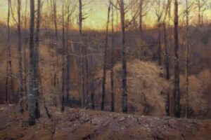 A tonalist landscape painting of a dense, leafless forest on a hillside at dusk. Slender, dark tree trunks punctuate the foreground, while the forest floor and distant hills are rendered in textured, muted shades of brown, ochre, and deep violet. Along the high horizon line, a striking band of luminous, golden-yellow sky glows through the bare branches.