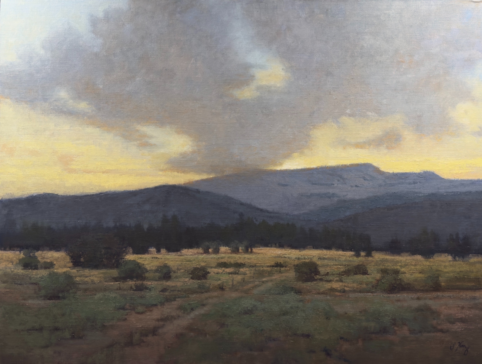 landscape painting by Shanna Kunz of a valley with mountains in the background
