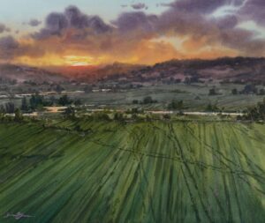 landscape painting by Brienne Brown of a beautiful sunset over a mountain range, wish a freshly mowed, lush green filed in the foreground.