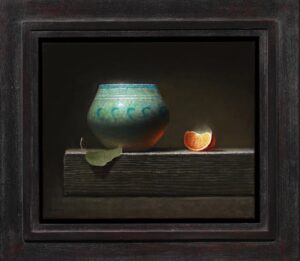still life painting by Jeremy Goodding of a blue vase next to a a wedge of a freshly sliced orange