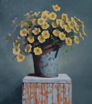 Original Still life oil painting by Rich Alexander of a large bunch of delicate yellow petunias in a blue bucket sitting atop a rustic wooden crate.